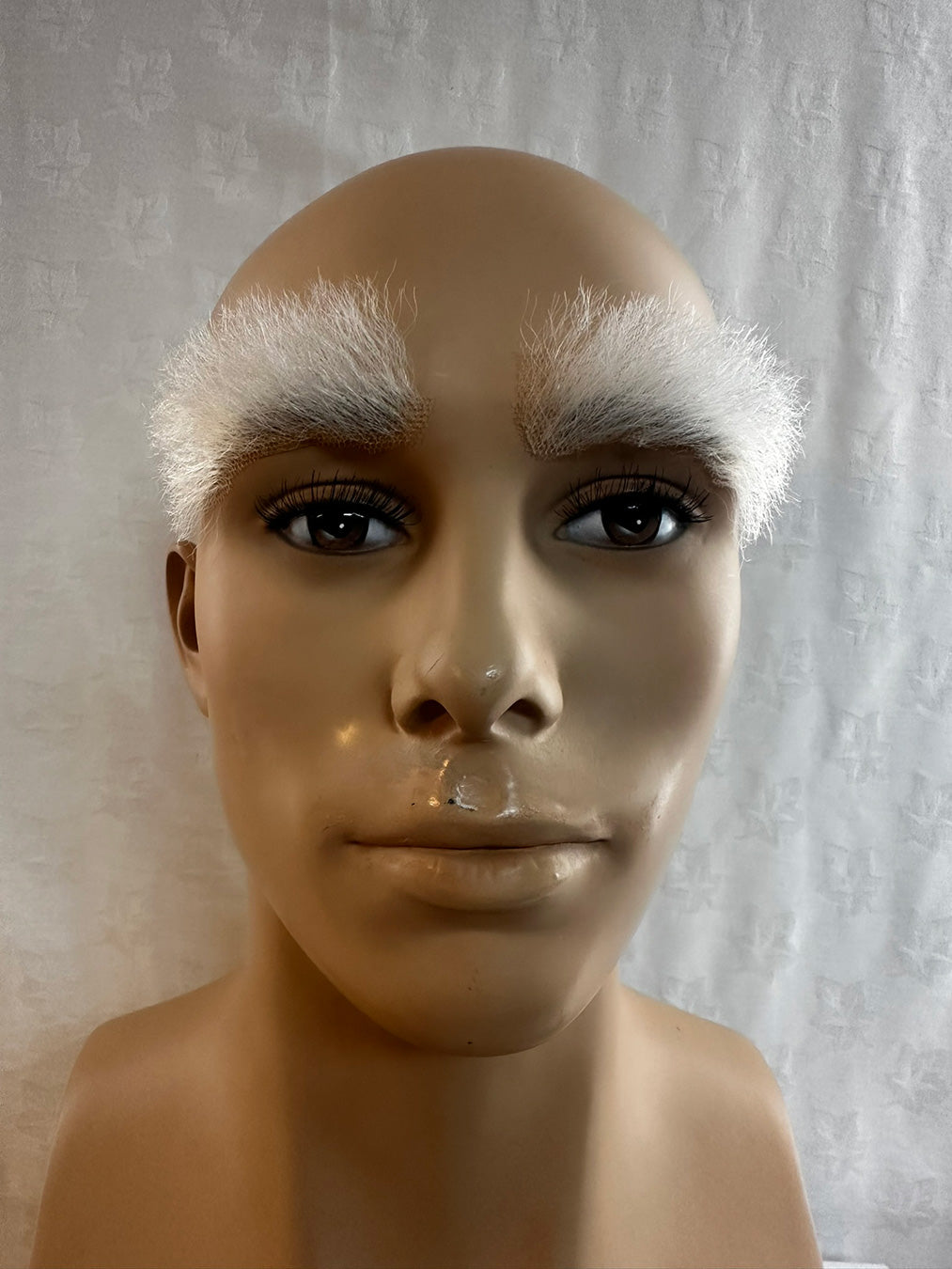 Picture of large white prosthetic eyebrow no7