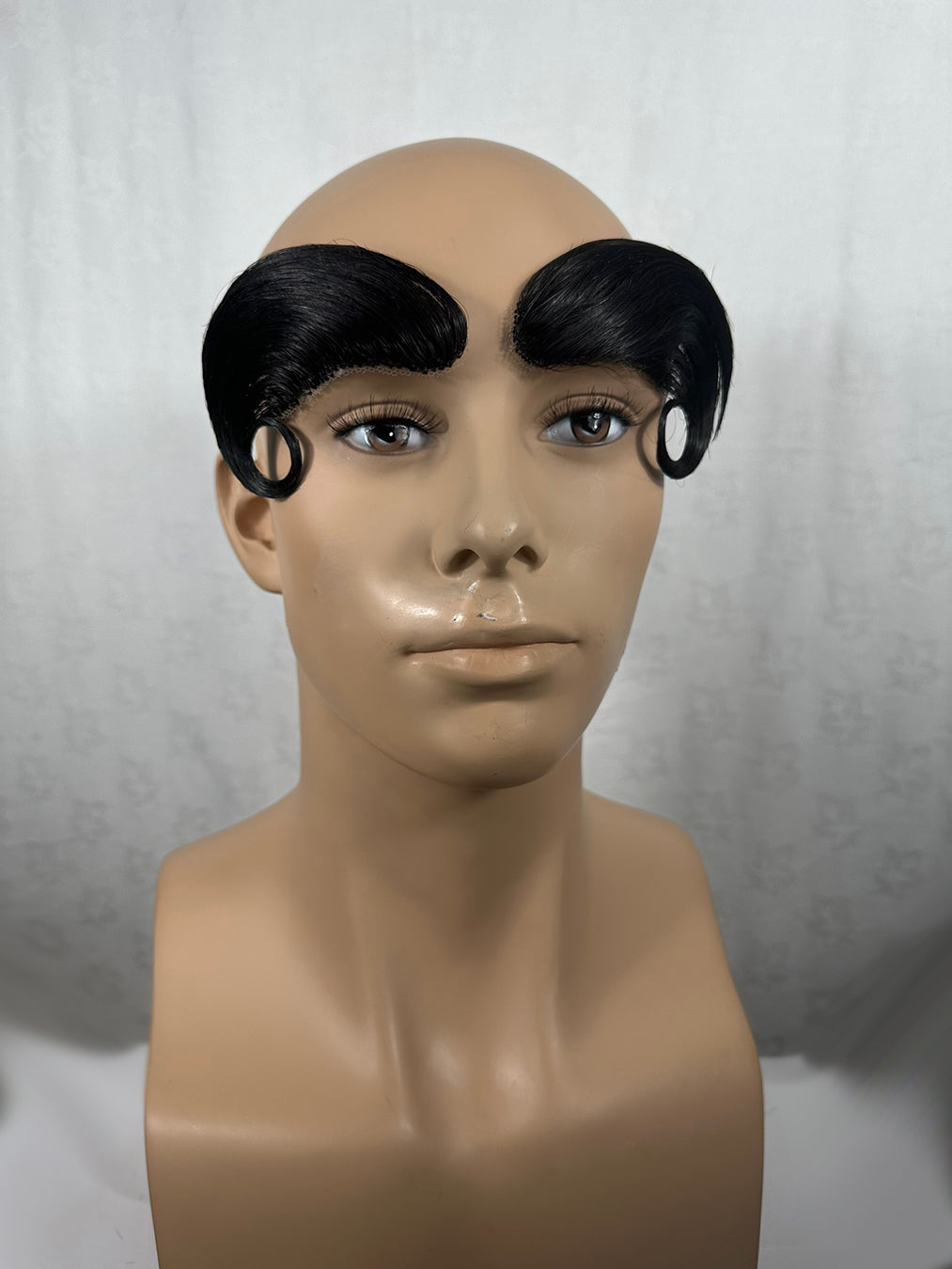 Image of massive prosthetic eyebrows